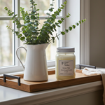 Load image into Gallery viewer, 16 oz Mason jar hand poured Green Tea Candle jar with a plant on a wooden tray by a window. Southern Charm Farmhouse
