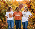 Load image into Gallery viewer, Three women standing together in an apple orchard wearing Fall-themed t-shirts.  Southern Charm Farmhouse.

