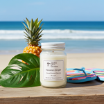 Load image into Gallery viewer, 16 oz Mason Jar of Hawaiian Ginger hand poured candle with a pineapple and flip-flops on a beach setting. Southern Charm Farmhouse
