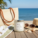 Load image into Gallery viewer, 2 wick hand poured Candle labeled 'Hawaiian Tropic' on a wooden surface with beach accessories in the background. Southern Charm Farmhouse.
