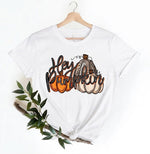 Load image into Gallery viewer, White t-shirt with 'Hey Pumpkin' text and pumpkins design on a hanger with greenery. Southern Charm Farmhouse.
