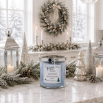 Load image into Gallery viewer, A hand-poured scented candle in a clear glass jar with a silver lid sits on a marble countertop in a decorated holiday kitchen. The label reads 'Jack Frost' by 'Southern Charm Farmhouse'.
