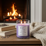Load image into Gallery viewer, Lavender Candle with 2 wicks in front of a fireplace with a knit sweater and old books beside it. Southern Charm Farmhouse.
