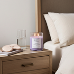 Load image into Gallery viewer, 2 wick hand poured Lavender candle on a night stand by the bed with a glass of water. Southern Charm Farmhouse.
