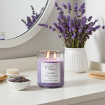 Load image into Gallery viewer, 2 wick hand poured Lavender Candle on a white vanity with Lavender flowers beside it. Southern Charm Farmhouse.
