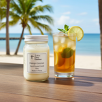 Load image into Gallery viewer, Mango Coconut hand poured candle and iced tea with lemon and mint on a beach setting. Southern Charm Farmhouse.
