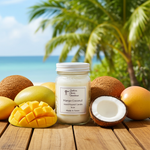 Load image into Gallery viewer, Mango Coconut Candle 16 oz Mason jar with coconuts and mangoes on a wooden surface with a tropical background. Southern Charm Farmhouse.
