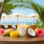 Load image into Gallery viewer, Southern Charm Farmhouse Sweet Mango and Coconut 2-wick candle styled on a breezy outdoor patio table with tropical greenery. Southern Charm Farmhouse.
