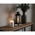 Load image into Gallery viewer, 16 oz Hand Poured Midsummer's Night Candle in a mason  jar, black lantern, and vase on a wooden surface. Southern Charm Farmhouse.
