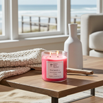 Load image into Gallery viewer, Pink 2 wick hand poured Pink Sands candle on a wooden table with a scenic view outside the window. Southern Charm Farmhouse.
