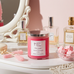 Load image into Gallery viewer, Pink sugar 2 wick hand poured candle with decorative items on a table. Southern Charm Farmhouse.
