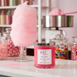Load image into Gallery viewer, Pink Sugar Candle with 2 Wicks. Pink cotton candy sitting next to it and a pink candy displayed in a candy store setting. Southern Charm Farmhouse.
