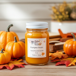 Load image into Gallery viewer, 16 oz mason Jar of 'Pumpkin Pickin' hand poured candle with pumpkins and fall leaves on a wooden surface.  Southern Charm Farmhouse.

