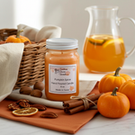 Load image into Gallery viewer, 16 oz mason jar Pumpkin spice hand poured candle with pumpkins, cinnamon, and a pitcher of iced tea on a table.  Southern Charm Farmhouse.
