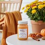 Load image into Gallery viewer, 16 oz mason jar Pumpkin spice hand poured candle on a table with flowers and pumpkins in the background.  Southern Charm Farmhouse.
