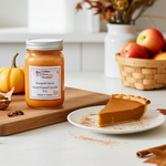 Load image into Gallery viewer, 16 oz mason jar Pumpkin spice hand poured candle on a cutting board with pumpkin pie and pumpkins in the background.  Southern Charm Farmhouse.
