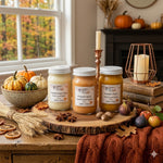 Load image into Gallery viewer, Three 16 oz mason jars of hand poured candles labeled Toasted Pumpkin Spice, Pumpkin Spice and Pumpkin Pickin on a wooden surface with autumn decorations.  Southern Charm Farmhouse.
