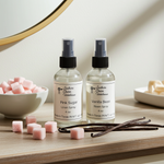 Load image into Gallery viewer, One Room spray and One Linen Spray bottle labeled 'Pink Sugar' and 'Vanilla Bean' on a wooden surface with pink sugar cubes and vanilla beans. Southern Charm Farmhouse.
