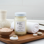Load image into Gallery viewer, Spa Day candle in a 16 oz mason jar surrounded by bath salts and towels on a wooden tray. Southern Charm Farmhouse.

