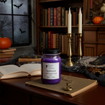 Load image into Gallery viewer, 16 oz mason jar Purple hand poured candle labeled 'Spellbound' on a wooden surface with Halloween decorations. Southern Charm Farmhouse.
