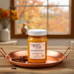 Load image into Gallery viewer, Spiced Rum Pumpkin hand poured candle in a jar on a copper tray with autumn decor in the background. Southern Charm Farmhouse.
