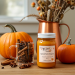 Load image into Gallery viewer, Spiced Rum Pumpkin hand poured candle jar with pumpkins, cinnamon sticks, and a mug on a wooden surface. Southern Charm Farmhouse.
