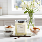 Load image into Gallery viewer, Southern Charm Farmhouse 2-wick Sweet Vanilla Caramel candle in a clear glass jar, styled on a white kitchen marble countertop with warm natural lighting.

