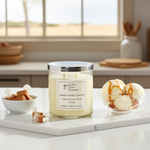 Load image into Gallery viewer, 2 wick hand poured Candle labeled 'Sweet Vanilla Caramel' on a kitchen counter with ice cream and caramel candies. Southern Charm Farmhouse.
