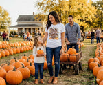 Load image into Gallery viewer, Woman wearing a t shirt that reads Take Me to the Pumpkin Patch and child with pumpkins at a pumpkin patch. Southern Charm Farmhouse.
