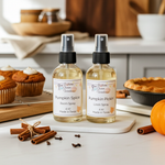 Load image into Gallery viewer, Two bottles of pumpkin-themed room and linen spray with pumpkins and cinnamon sticks on a kitchen counter.  Southern Charm Farmhouse.
