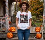 Load image into Gallery viewer, Woman wearing a white t-shirt with a graphic design, standing in front of Halloween decorations including pumpkins and a skeleton. Southern Charm Farmhouse.
