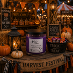 Load image into Gallery viewer, A purple scented hand poured candle labeled 'Trick or Treat' by Southern Charm Farmhouse, sits on a rustic wooden table decorated for Halloween, surrounded by pumpkins, lanterns, candy buckets, and autumn signs.
