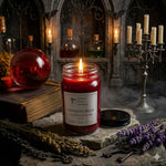 Load image into Gallery viewer, Vampire's Blood hand poured candle in a jar with a dark, mystical setting. Southern Charm Farmhouse.

