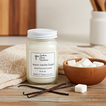 Load image into Gallery viewer, 16 oz Mason Jar hand poured Warm Vanilla Sugar candle on a wood surface with a bowl of sugar and scarf beside it. Southern Charm Farmhouse.
