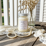 Load image into Gallery viewer, Western Lace Candle in a 16 oz. Mason jar on a farmhouse weathered porch with lace, pearls and flowers. Southern Charm Farmhouse.
