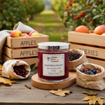 Load image into Gallery viewer, Hand poured Candle labeled 'Apple Berry Harvest' on a wooden surface with fruit crates and bags of berries in an outdoor setting. Southern Charm Farmhouse.

