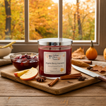 Load image into Gallery viewer, Jar of 'Apple Berry Harvest' hand poured candle on a wooden cutting board with autumn-themed items. Southern Charm Farmhouse.
