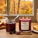 Load image into Gallery viewer, Hand poured Candle labeled 'Apple Berry Harvest' next to a jar of jam on a table with autumn scenery outside the window. Southern Charm Farmhouse.
