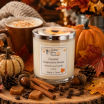 Load image into Gallery viewer, A hand poured candle in a clear glass jar with a silver lid and a cream label reading  Caramel Cappuccino Brulee, styled on a wood slice with cinnamon sticks, coffee beans, acorns, autumn leaves, pumpkins, and a mug of cappuccino in the background. Southern Charm Farmhouse.
