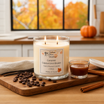 Load image into Gallery viewer, Hand Poured Candle labeled 'Caramel Capuccino Brulee' on a wooden board with coffee beans, a cup of coffee, and a pumpkin in the background. Southern Charm Farmhouse.
