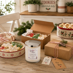 Load image into Gallery viewer, A holiday-themed cookie gift set on a rustic wooden table, featuring a jar candle labeled 'Christmas Cookie' alongside boxes and mugs of decorated sugar cookies. Southern Charm Farmhouse.

