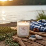 Load image into Gallery viewer, 2 Wick Candle labeled 'Lakeside Cabin' on a wooden surface with nature elements by a lake. Southern Charm Farmhouse.
