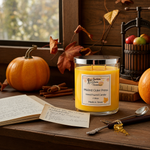 Load image into Gallery viewer, Hand poured Candle labeled 'Mulled Cider Press' on a wooden surface with pumpkins, cinnamon sticks, and autumn leaves. Southern Charm Farmhouse.
