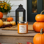 Load image into Gallery viewer, A 16 oz mason jar hand poured candle labeled 'Pumpkin Pickin' sits on a wooden porch step surrounded by pumpkins, a lantern, and fall decor. Southern Charm Farmhouse.
