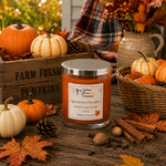 Load image into Gallery viewer, A jar hand poured candle labeled 'Spiced Rum Pumpkin' by Southern Charm Farmhouse. sits on a rustic wooden table surrounded by fall decorations, including pumpkins, pinecones, cinnamon sticks, leaves, and a plaid blanket in the background.
