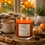 Load image into Gallery viewer, A lit hand poured candle in a clear glass jar sits on a wooden tray in a cozy fall setting, surrounded by a mug, cinnamon sticks, star anise, small pumpkins, and a knitted blanket. The candle label reads Southern Charm Farmhouse and Spiced Rum Pumpkin.
