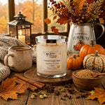 Load image into Gallery viewer, A scented hand poured candle in a clear glass jar with a silver lid sits on a wooden surface in a cozy autumn setting. The label reads  'Toasted Pumpkin Spice'. Southern Charm Farmhouse.
